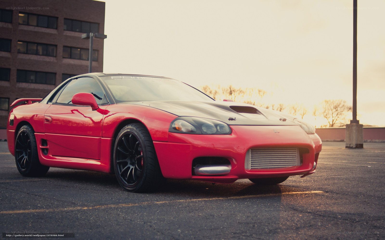 Red sports car in parking lot