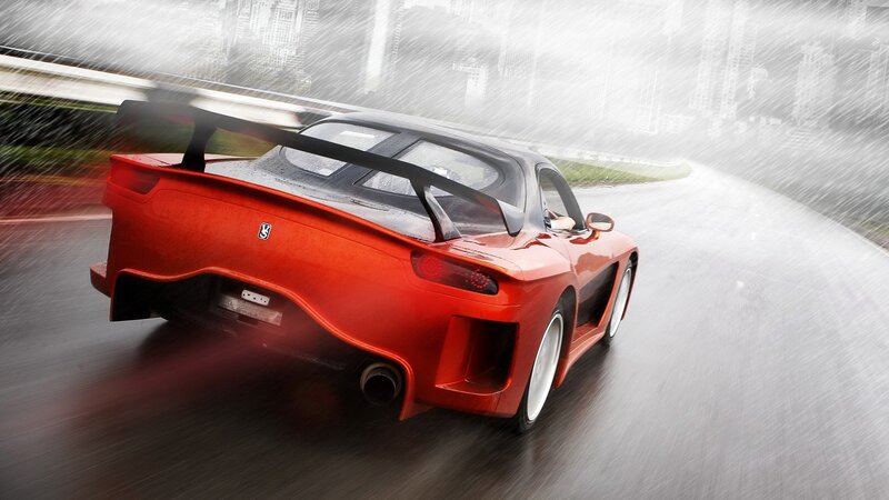 Red sports car in rain