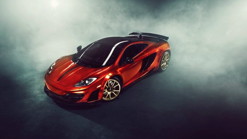 red sports car in smoke