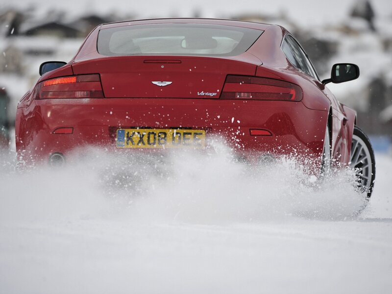 Red sports car in snow