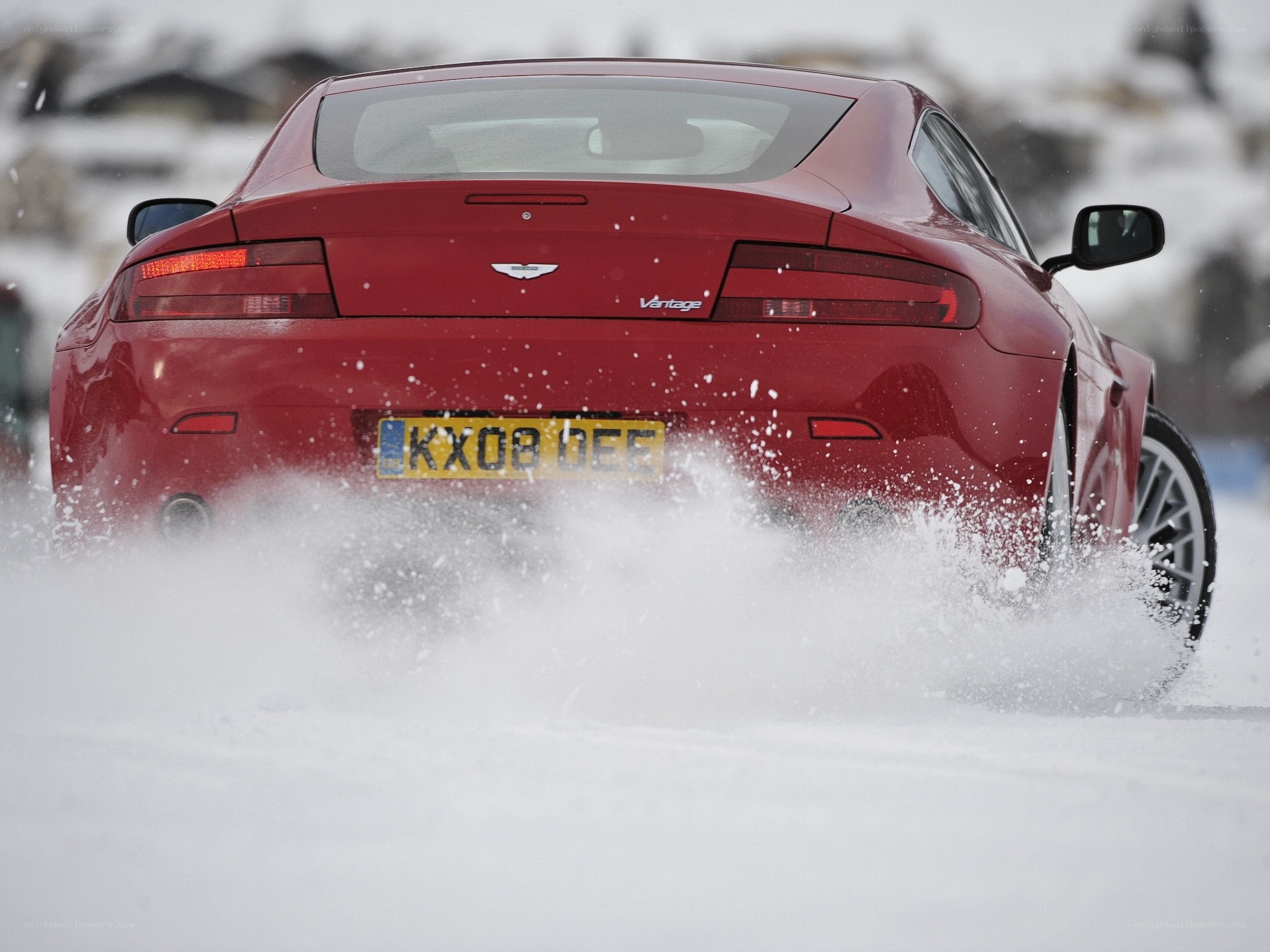 Red sports car in snow