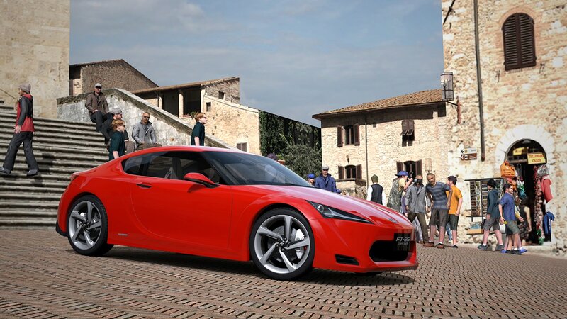 Red sports car in town square