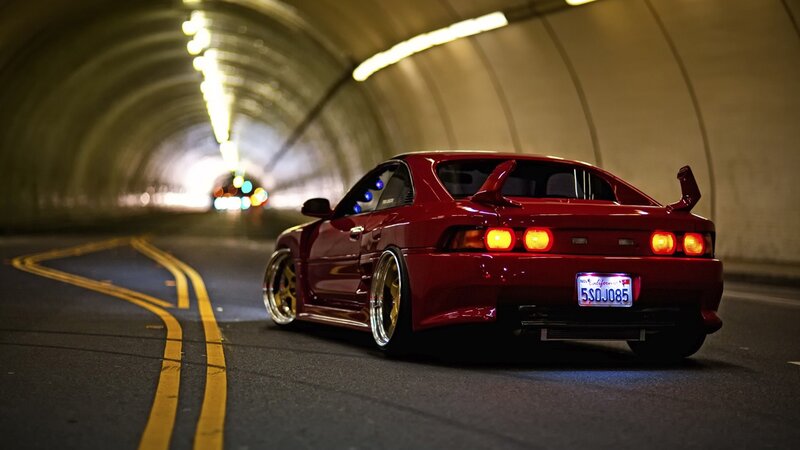 red sports car in tunnel
