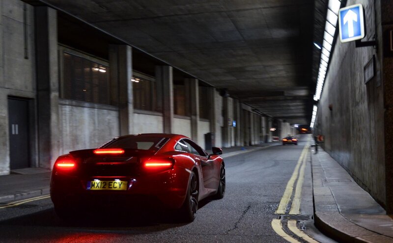 Red sports car in tunnel