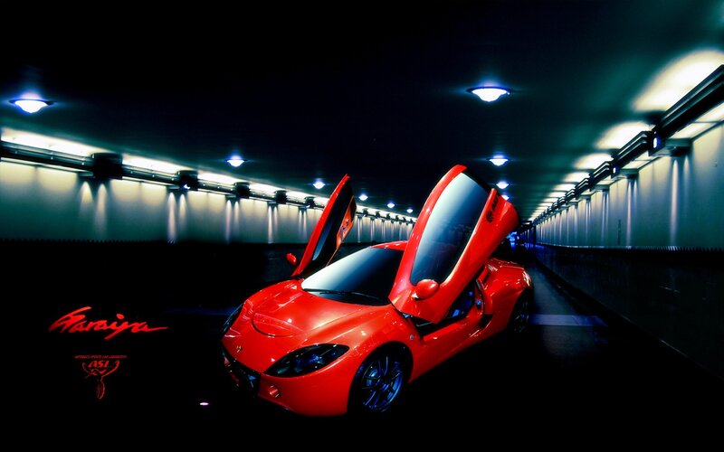 Red sports car in tunnel