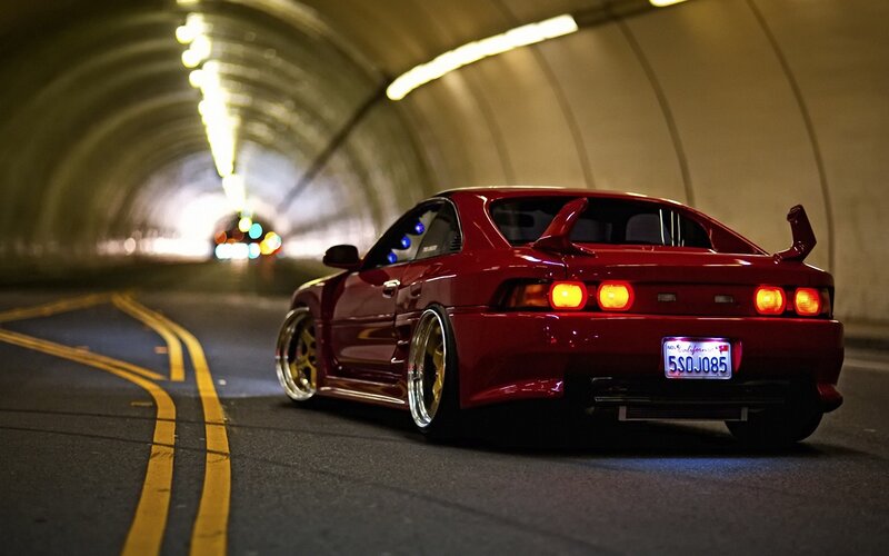 Red sports car in tunnel