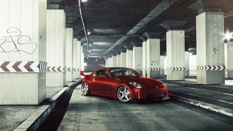 Red sports car in underground tunnel