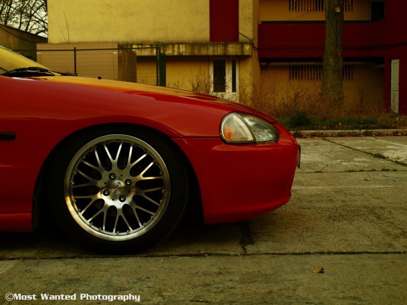 red sports car in urban setting