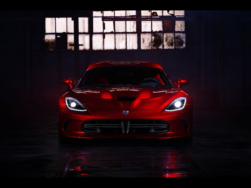 Red sports car in warehouse