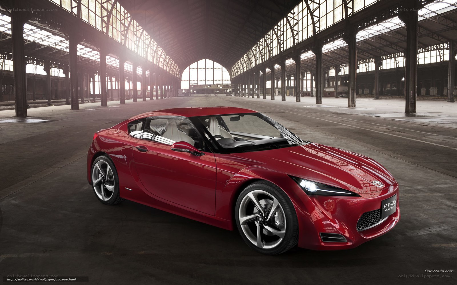 Red sports car in warehouse