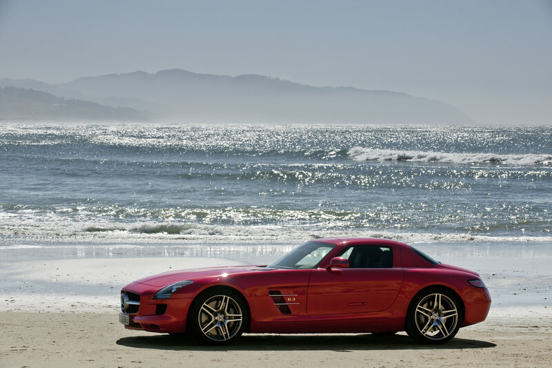 Red sports car on a beach