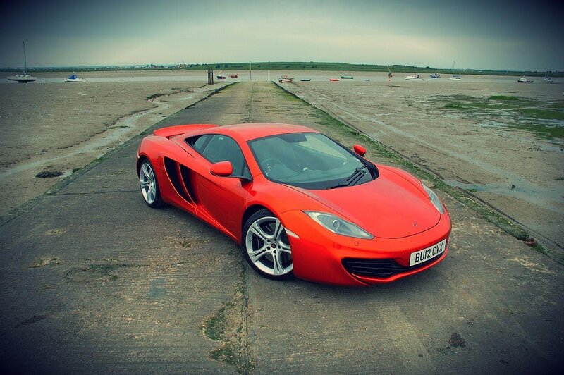 Red sports car on a beach