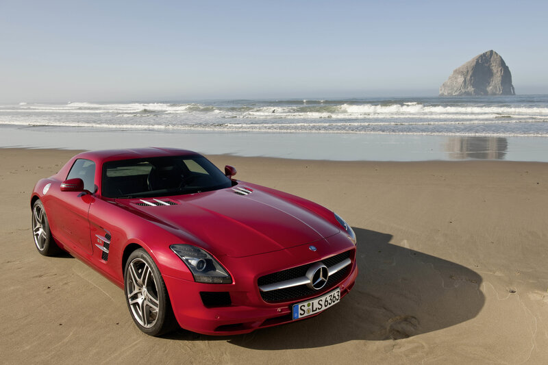 Red sports car on a beach