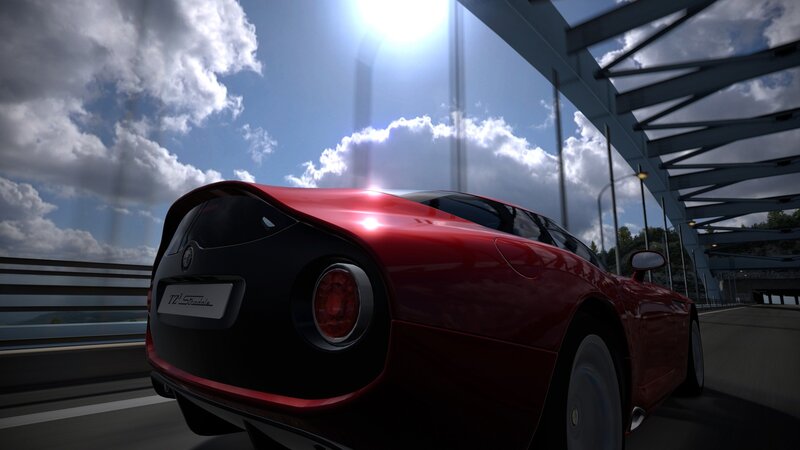 red sports car on a bridge