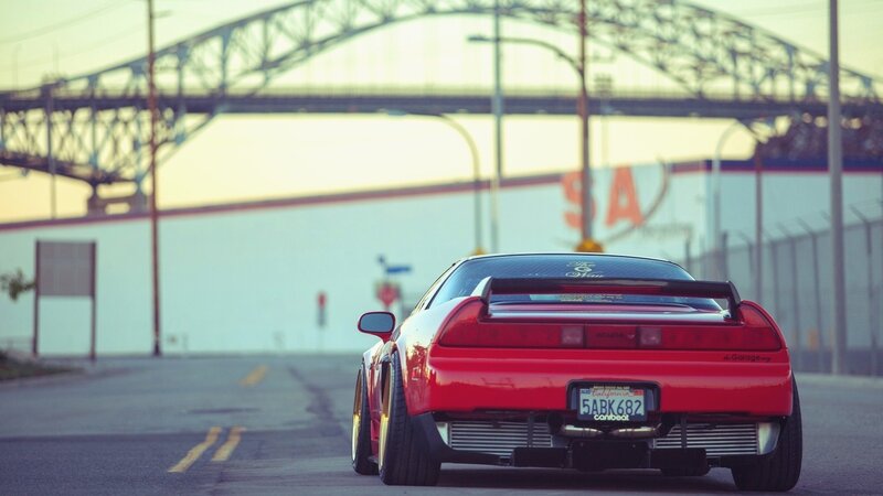Red sports car on a city street