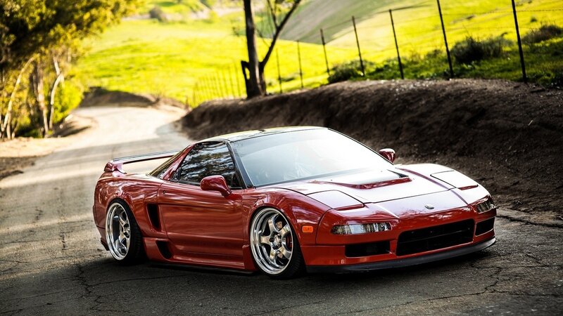 Red sports car on a country road