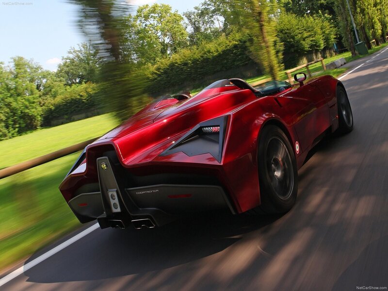 red sports car on a country road