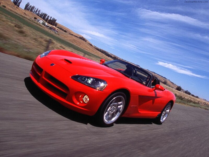 Red sports car on a country road