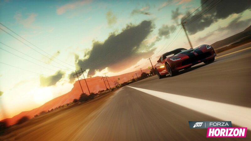 Red sports car on a desert road