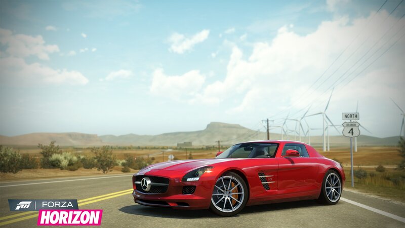 Red sports car on a desert road