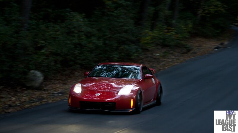 Red sports car on a forest road
