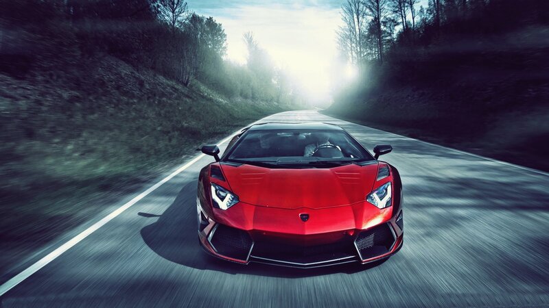 Red sports car on a forest road