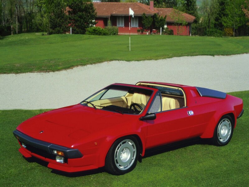 Red sports car on a golf course