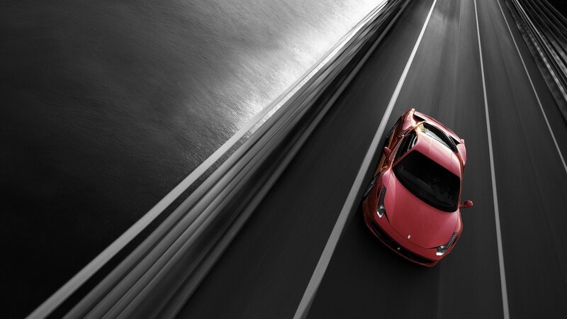 Red sports car on a highway