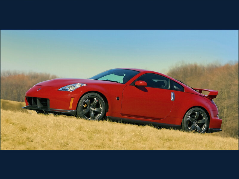 Red sports car on a hill