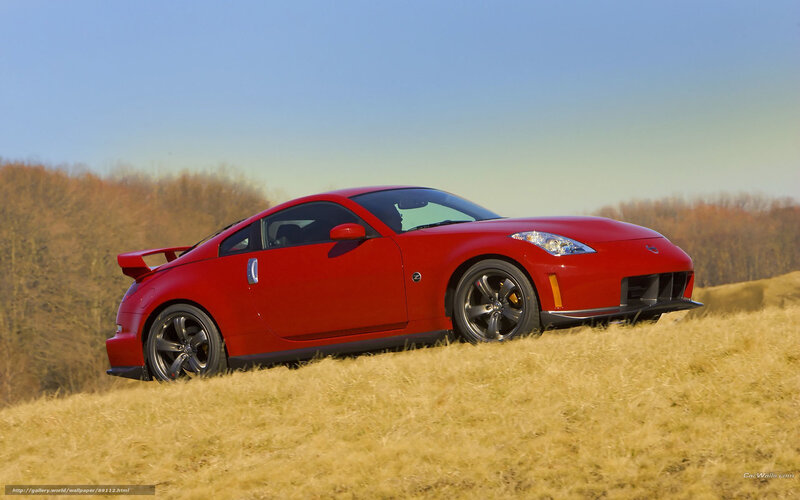 Red sports car on a hill