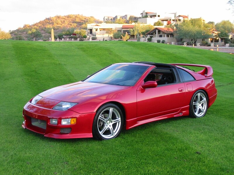 Red sports car on a lawn