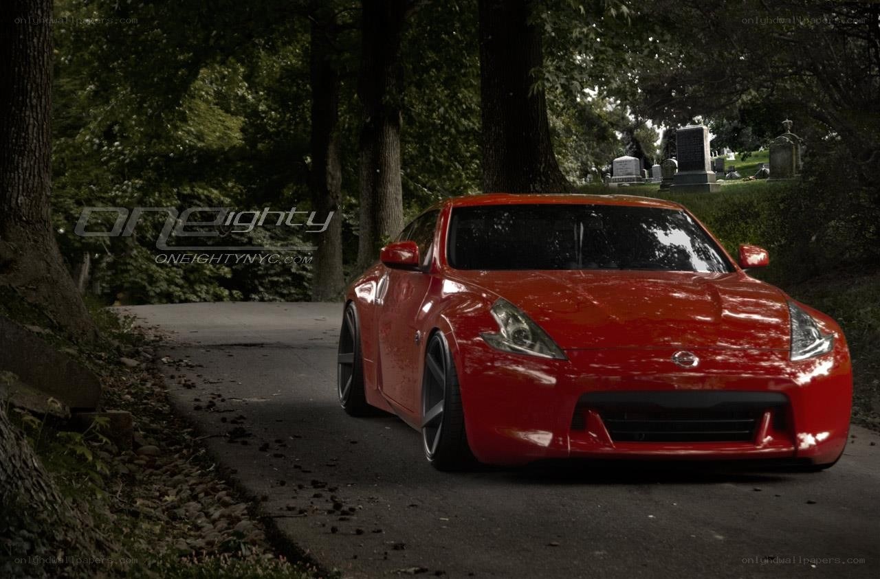 Red sports car on a path