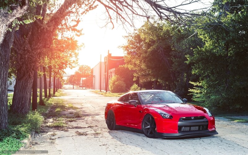 Red sports car on a quiet street