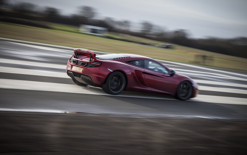 Red sports car on a racetrack