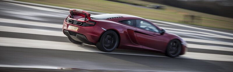 Red sports car on a racetrack