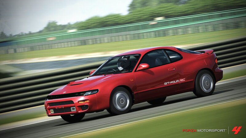 Red sports car on a racetrack