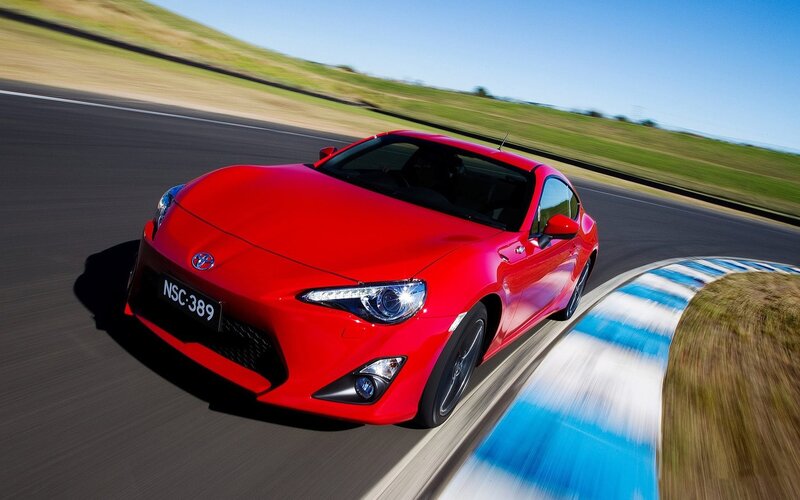 Red sports car on a racetrack