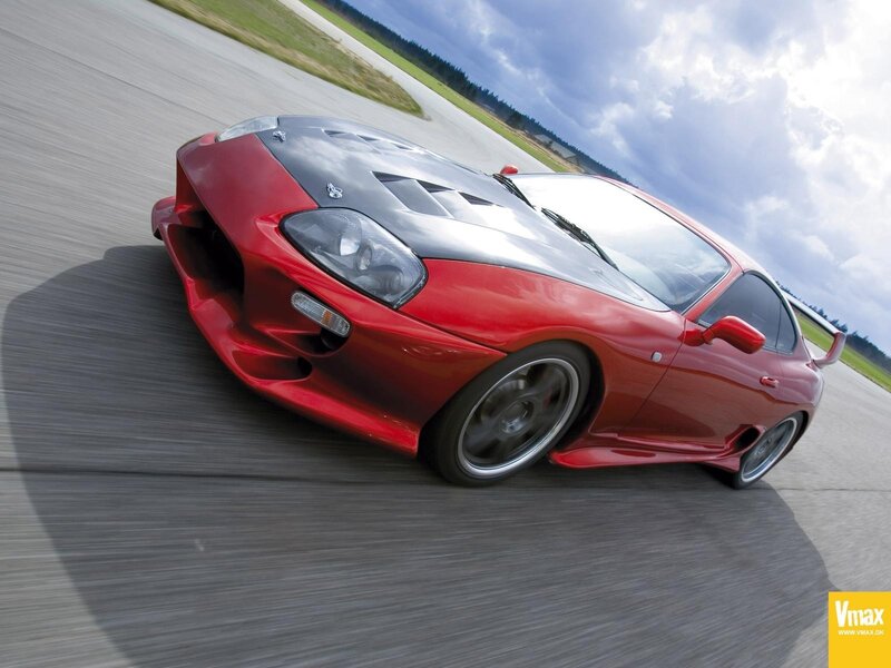 Red sports car on a racetrack