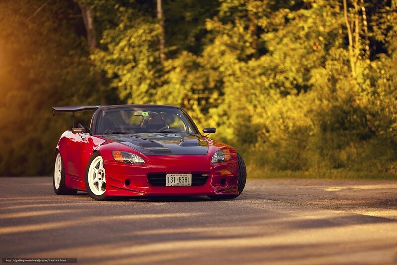 Red sports car on a road