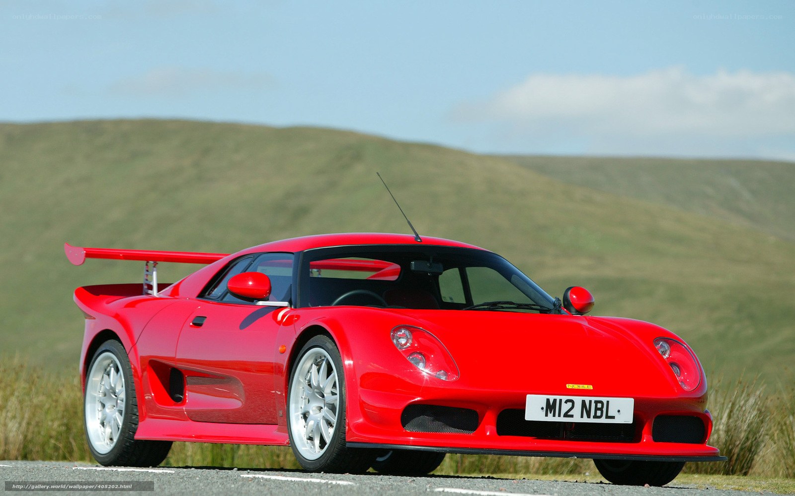 Red sports car on a road