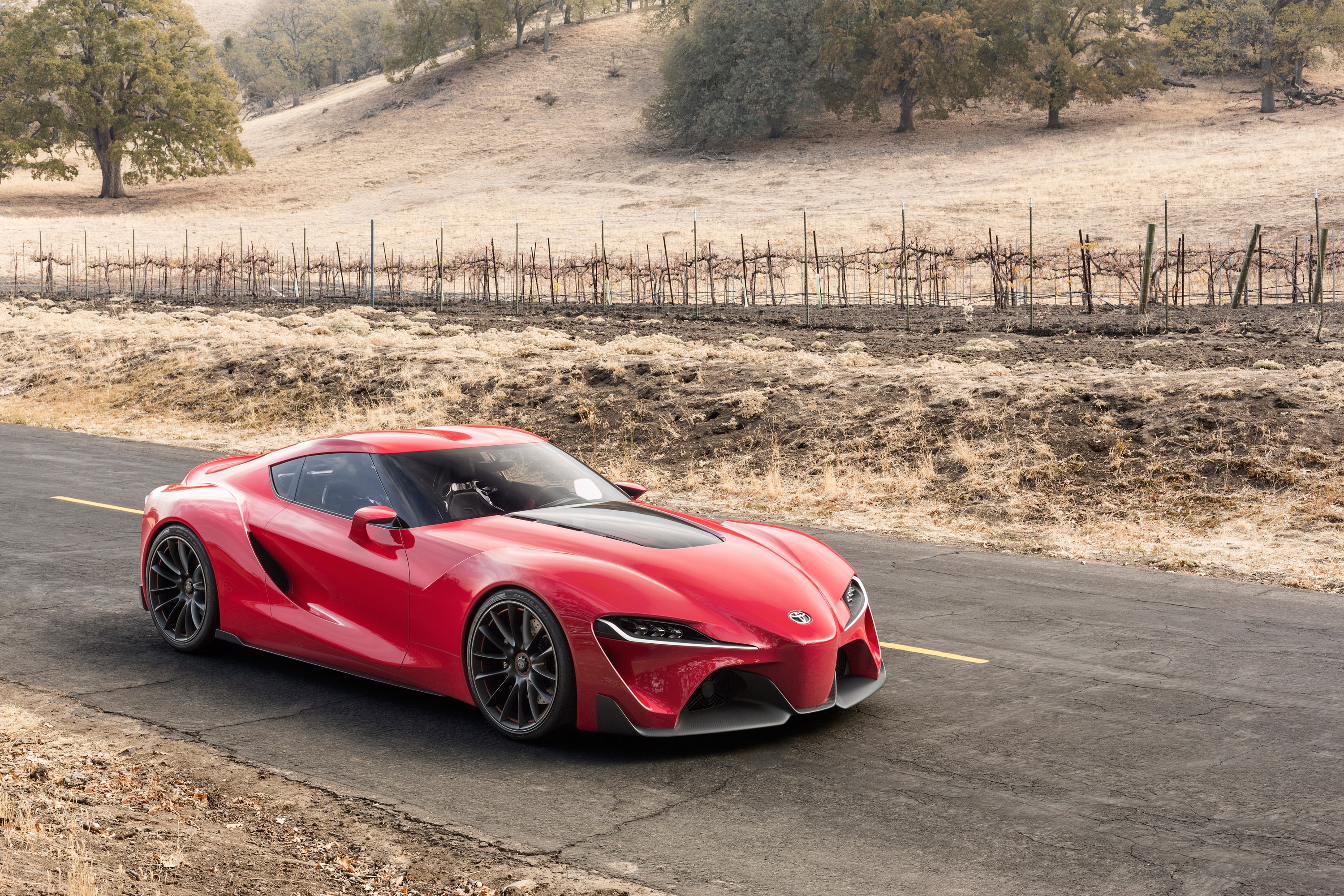 Red sports car on a road