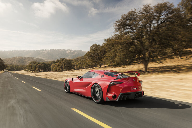 Red sports car on a road