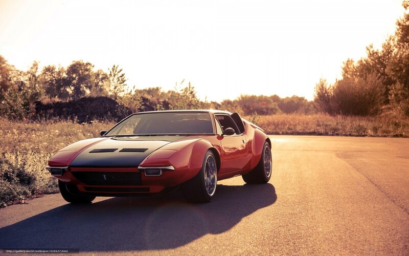 Red sports car on a road