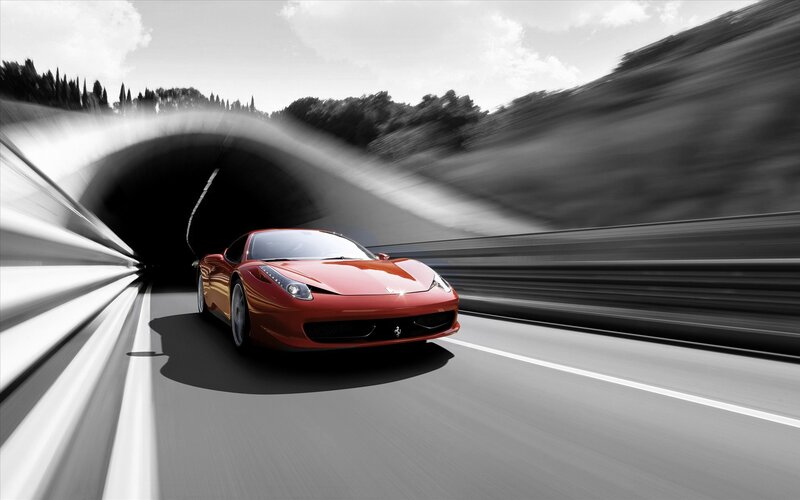 Red sports car on a road