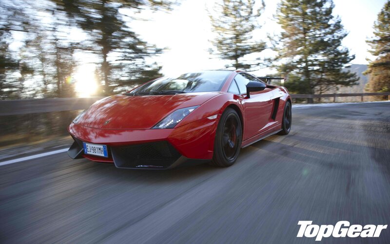 red sports car on a road
