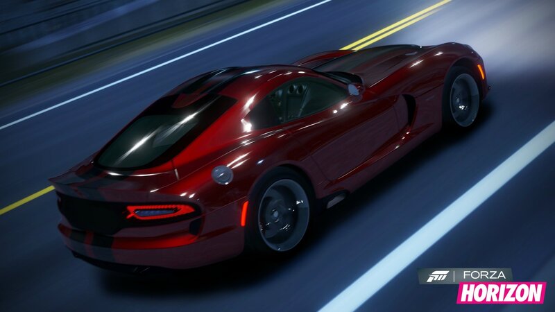 Red sports car on a road