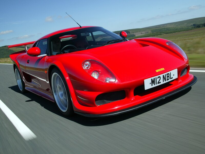 Red sports car on a road