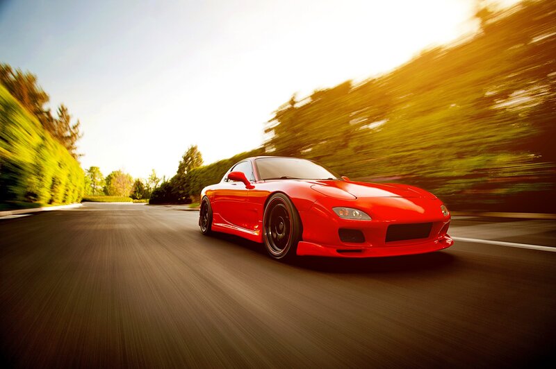 Red sports car on a road