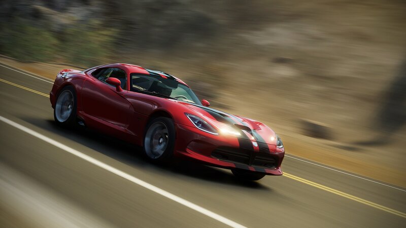 Red sports car on a road