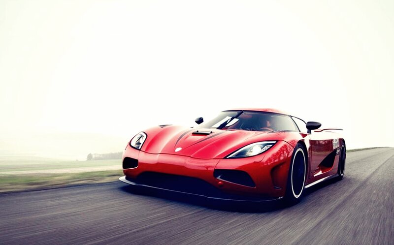 red sports car on a road